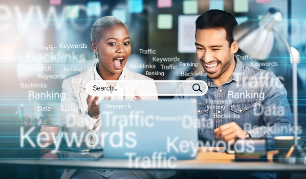 How Marketing Agencies Transform Ideas Into Results 3 Two colleagues excitedly reacting while working on a laptop, with digital overlays of marketing-related keywords like 'Search', 'Traffic', and 'Keywords'.